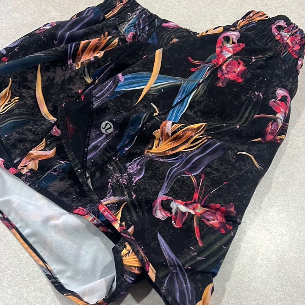 Lululemon black yellow blue red tropical print shorts.